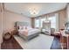 Spacious main bedroom with plush bed, large mirror, and neutral color palette at 975 Shorthill Ln, Fort Mill, SC 29715