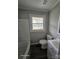 Bathroom featuring a tub with shower, a vanity, and a window for natural light at 1064 S Stonewall Ave, Rock Hill, SC 29732