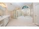 Primary bathroom with soaking tub, shower, and double vanity at 11805 Prestmoor Ct, Charlotte, NC 28262