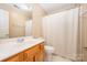 Clean bathroom with a shower/tub combo, vanity, and toilet at 11805 Prestmoor Ct, Charlotte, NC 28262