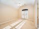 Well-lit bedroom featuring double doors and a ceiling fan at 11805 Prestmoor Ct, Charlotte, NC 28262