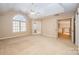 Bright bedroom with vaulted ceiling, ceiling fan, and carpet at 11805 Prestmoor Ct, Charlotte, NC 28262