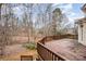 Wooden deck overlooking a wooded backyard at 11805 Prestmoor Ct, Charlotte, NC 28262