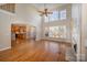 Spacious living room with hardwood floors, high ceilings, and a fireplace at 11805 Prestmoor Ct, Charlotte, NC 28262