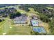 Aerial view showing community amenities including pool, tennis courts, and golf course at 13234 Hidcote Ct, Huntersville, NC 28078