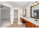 Double vanity bathroom with access to walk-in closet and bedroom at 13234 Hidcote Ct, Huntersville, NC 28078