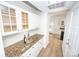 Butlers pantry with granite countertop and glass-front cabinets at 13234 Hidcote Ct, Huntersville, NC 28078