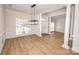 Dining room with hardwood floors, chandelier, and window at 13234 Hidcote Ct, Huntersville, NC 28078