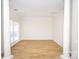 Bright dining room with hardwood floors and wainscoting at 13234 Hidcote Ct, Huntersville, NC 28078