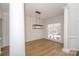 Spacious dining room featuring wood floors and a chandelier at 13234 Hidcote Ct, Huntersville, NC 28078