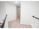 Upstairs hallway with carpeted floors and neutral walls at 13234 Hidcote Ct, Huntersville, NC 28078