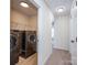 Laundry room with LG washer and dryer, and shelving at 13234 Hidcote Ct, Huntersville, NC 28078