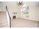 Bright living room featuring a fireplace and large windows at 13234 Hidcote Ct, Huntersville, NC 28078