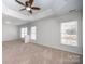 Main bedroom with ceiling fan and access to ensuite bath at 13234 Hidcote Ct, Huntersville, NC 28078