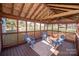 Relaxing screened porch with wooden deck and seating area at 13234 Hidcote Ct, Huntersville, NC 28078