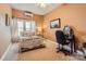 Bright bedroom with a double bed, a desk and chair, and two windows at 141 Silverspring Pl, Mooresville, NC 28117