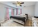 Well-lit bedroom with a queen-sized bed and soft carpeting at 141 Silverspring Pl, Mooresville, NC 28117