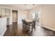 Dining area with a farmhouse table and chairs, and access to a deck at 141 Silverspring Pl, Mooresville, NC 28117