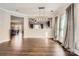 Spacious dining area with hardwood floors and a view into the kitchen at 141 Silverspring Pl, Mooresville, NC 28117