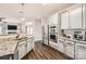 Modern kitchen with gray cabinets, granite countertops, and stainless steel appliances at 141 Silverspring Pl, Mooresville, NC 28117