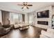 Living room with hardwood floors, fireplace, and comfortable seating at 141 Silverspring Pl, Mooresville, NC 28117