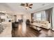 Bright living room with hardwood floors, comfy seating, and large windows at 141 Silverspring Pl, Mooresville, NC 28117