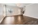 Living room featuring hardwood floors and a modern electric fireplace at 141 Silverspring Pl, Mooresville, NC 28117