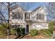 Two-story house with white siding, dark shutters, and a two-car garage at 14311 Riding Hill Ave, Charlotte, NC 28213