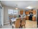 Kitchen with wooden cabinets, tile floors, and a dining area at 14311 Riding Hill Ave, Charlotte, NC 28213