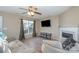 Living room with hardwood floors, fireplace, and comfortable seating at 14311 Riding Hill Ave, Charlotte, NC 28213