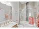 Bathroom featuring a modern sink vanity and a shower-over-tub with glass doors at 14531 Crosswater Ln, Charlotte, NC 28278