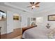 Spacious bedroom features crown molding, a ceiling fan and an ensuite bathroom at 14531 Crosswater Ln, Charlotte, NC 28278