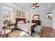 Spacious bedroom with tray ceiling, two windows and an ensuite bathroom at 14531 Crosswater Ln, Charlotte, NC 28278