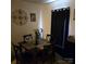 Small dining area with dark wood table and black curtains at 15 Hamiltons Bay Ct # A939, Lake Wylie, SC 29710