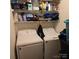 Laundry closet with washer, dryer, and storage shelves at 15 Hamiltons Bay Ct # A939, Lake Wylie, SC 29710