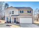 Two-story house with neutral siding, a two-car garage, and landscaping at 1529 Cannan Mountain Dr, Newton, NC 28658