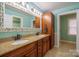 Double vanity bathroom with granite countertop and decorative mirror at 161 Moore Haven Dr, Salisbury, NC 28147