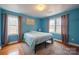 Bedroom with wood floors and calming blue walls at 161 Moore Haven Dr, Salisbury, NC 28147