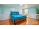 Bedroom with teal bedding, hardwood floors, and adjacent bathroom at 161 Moore Haven Dr, Salisbury, NC 28147