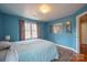 Bright bedroom featuring a window with wooded views at 161 Moore Haven Dr, Salisbury, NC 28147