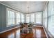 Sun-filled breakfast nook with table and chairs, and wood floors at 161 Moore Haven Dr, Salisbury, NC 28147