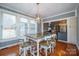 Bright breakfast nook with wood table and chairs, and wooded views at 161 Moore Haven Dr, Salisbury, NC 28147