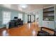 Home office with built-in shelving and hardwood floors at 161 Moore Haven Dr, Salisbury, NC 28147