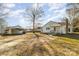 Front view of a ranch house with carport and yard at 1979 Charlotte Hwy, Mooresville, NC 28115