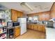 Kitchen with light wood cabinets and appliances at 1979 Charlotte Hwy, Mooresville, NC 28115