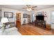 Living room with hardwood floors, fireplace and TV at 1979 Charlotte Hwy, Mooresville, NC 28115