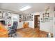 Home office with wood desk, chair, and railroad memorabilia at 1979 Charlotte Hwy, Mooresville, NC 28115