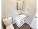 Clean bathroom with single sink vanity and updated toilet at 209 Vermont Dr, Stanley, NC 28164