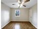 Cozy bedroom with hardwood floors and ceiling fan at 209 Vermont Dr, Stanley, NC 28164