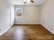 Bright bedroom featuring hardwood floors and a window at 209 Vermont Dr, Stanley, NC 28164